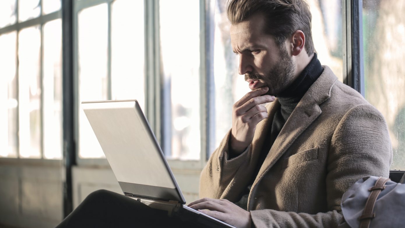 Man typing on laptop